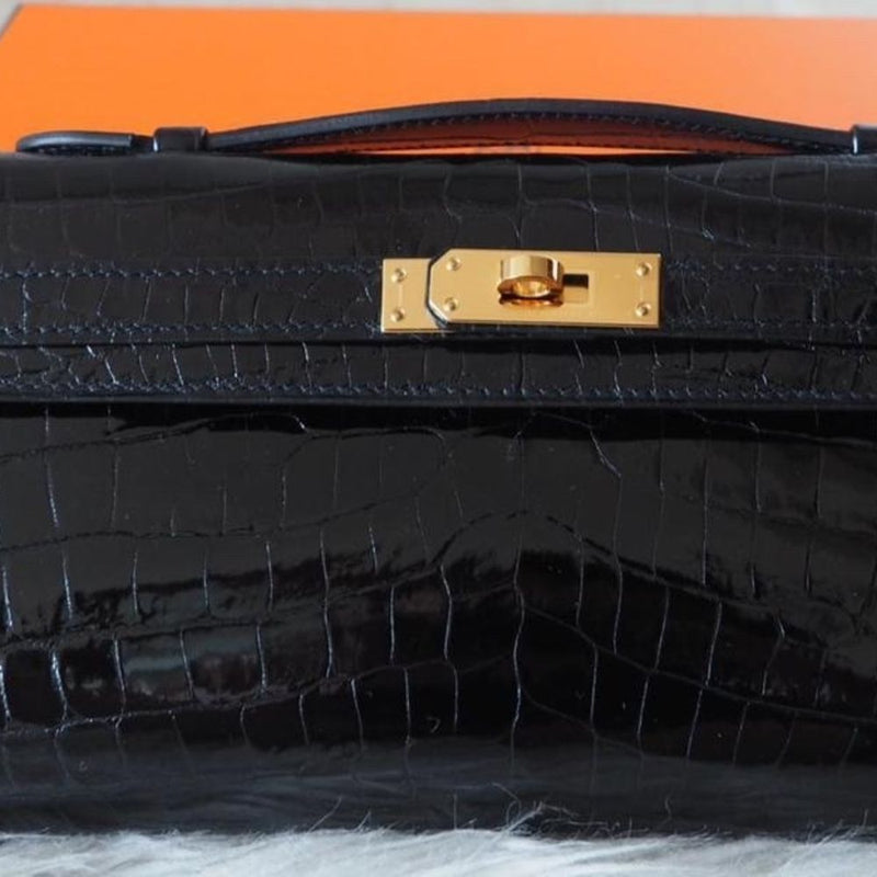 Hermès Kelly Cut Noir (Black) Crocodile Niloticus Lisse Gold Hardware GHW