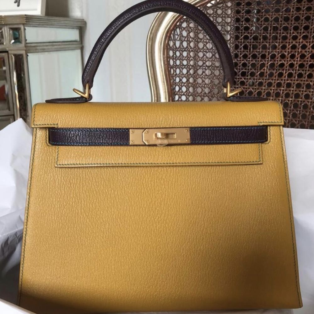 Hermès Kelly 28 Jaune Ambre/Prunoir Sellier Chevre Mysore Brushed Gold —  The French Hunter